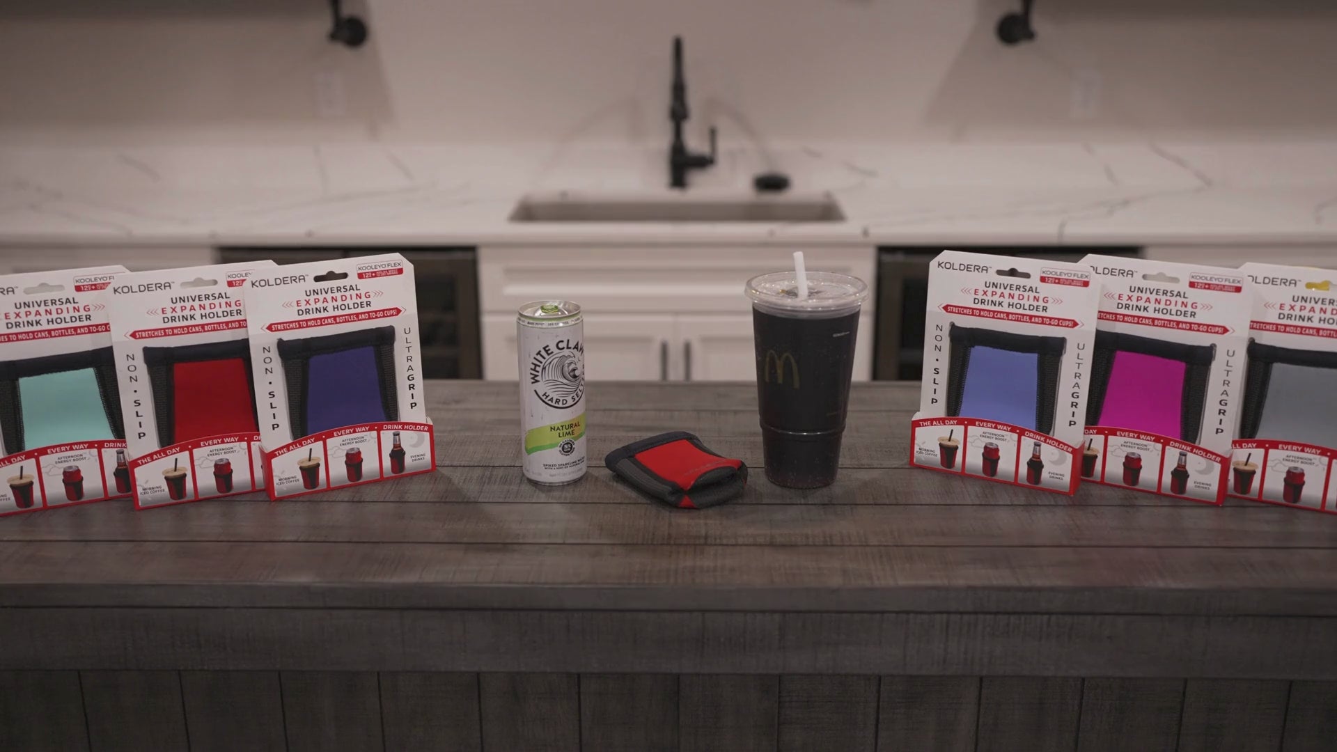 Load video: Red Koldera Kooleyo shown being loaded onto a slim can and a large to go soda